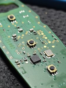 Close up of a PCB from a key remote